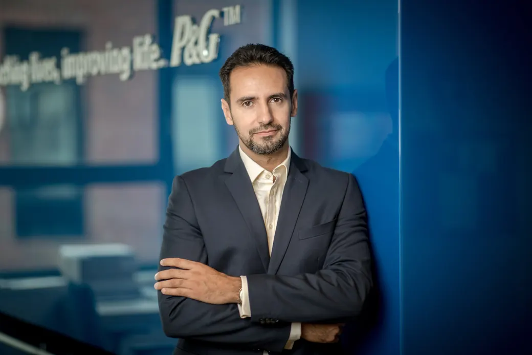 Gabriel Makki in a navy suit at the Procter & Gamble offices
